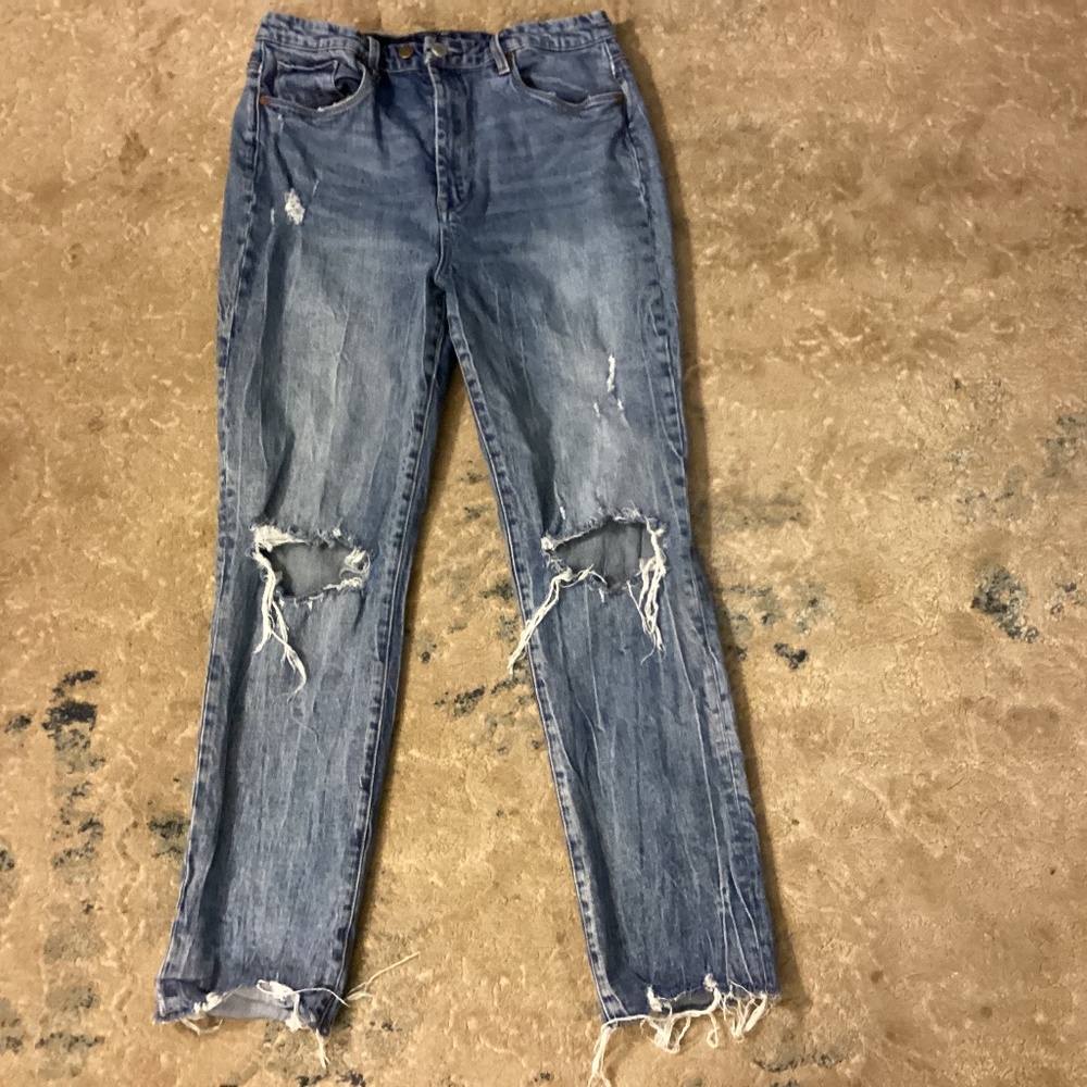 Distressed blue jeans